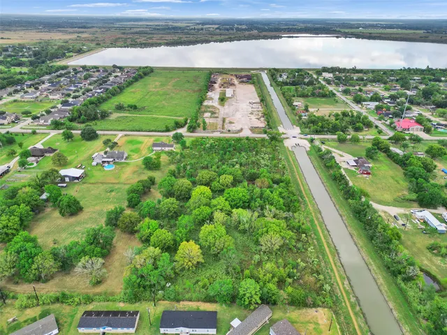 a view of a yard with potted plants