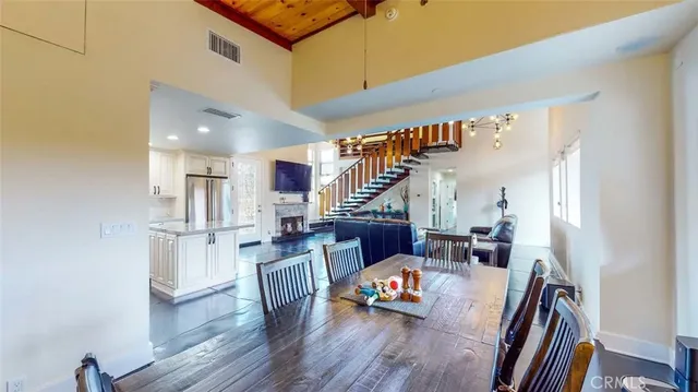 a view of a dining room with furniture and window