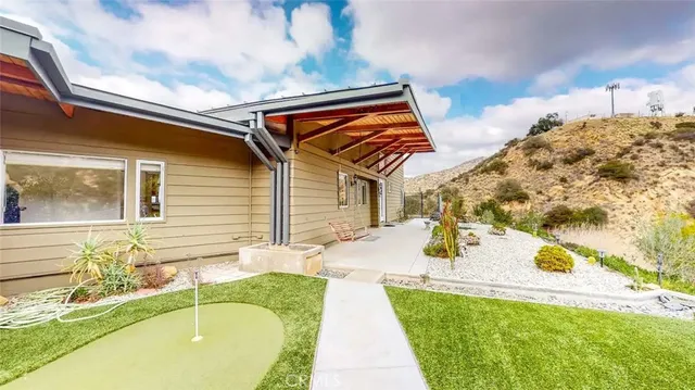 a swimming pool with outdoor seating