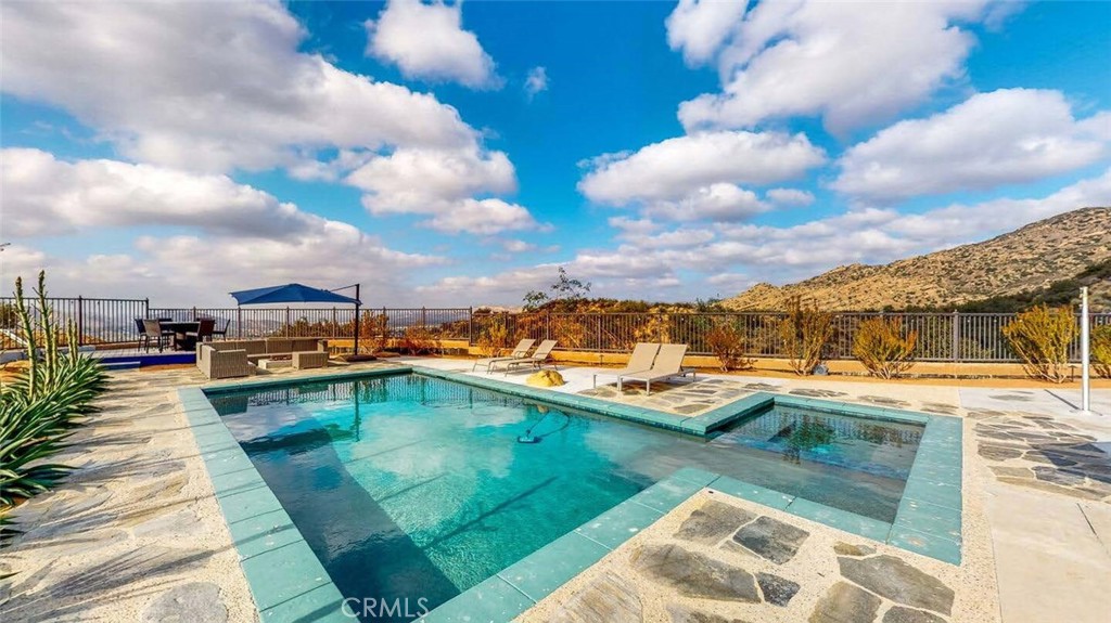 7300 Santa Susana Pass Road Simi Valley, CA 93063 - Photo 6 of 34 a view of a swimming pool with a lounge chair