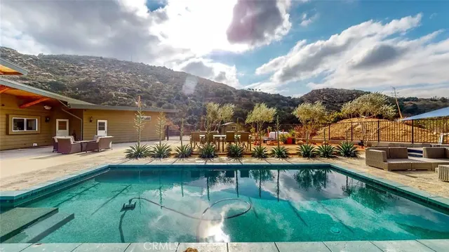 a view of a swimming pool with a patio