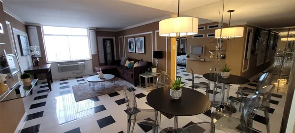 a living room with furniture and a window