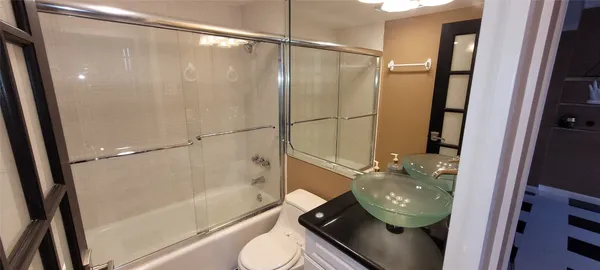 a bathroom with a sink and mirror