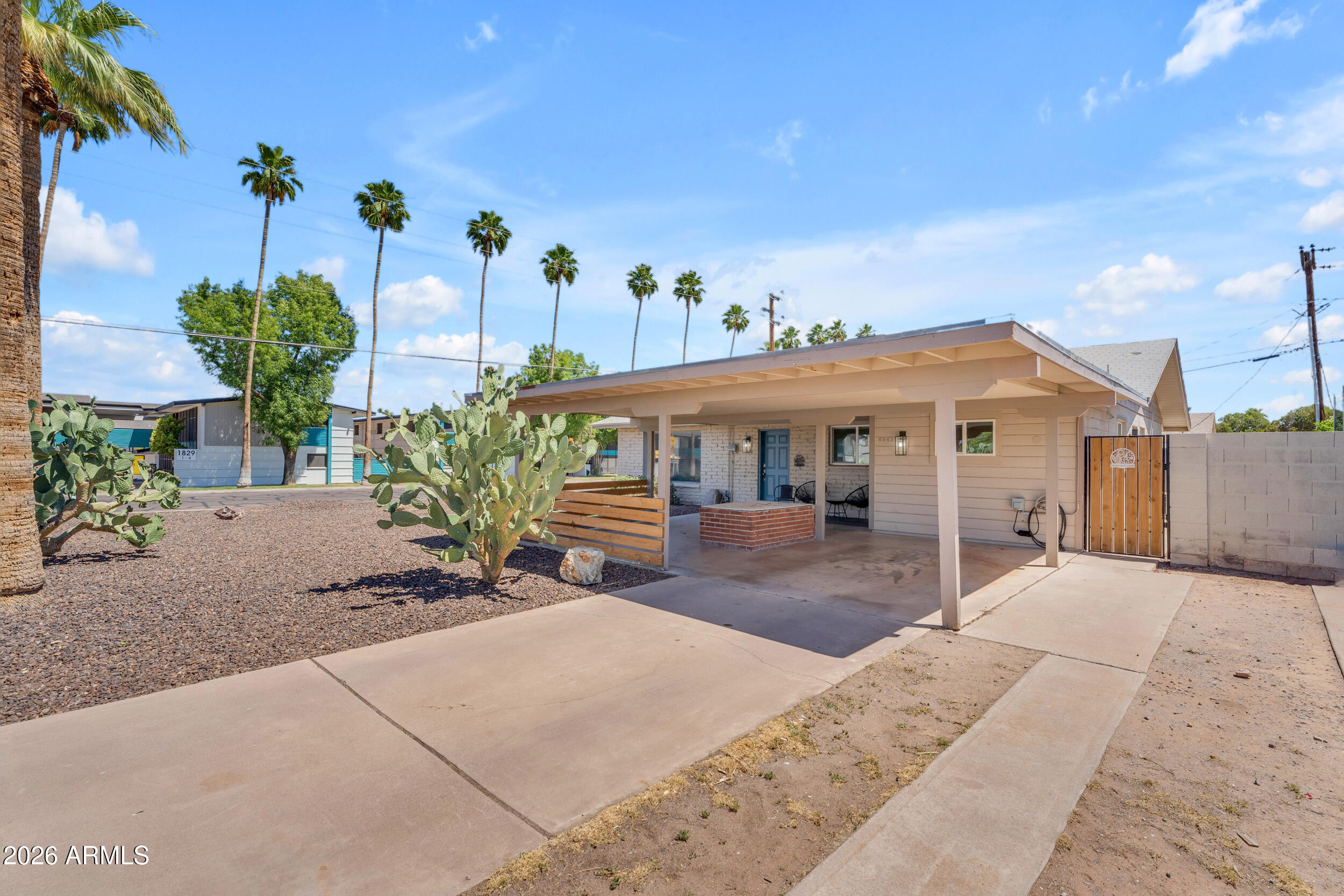 6943 East Granada Road Scottsdale, AZ 85257 - Photo 18 of 19 a view of a house with a patio