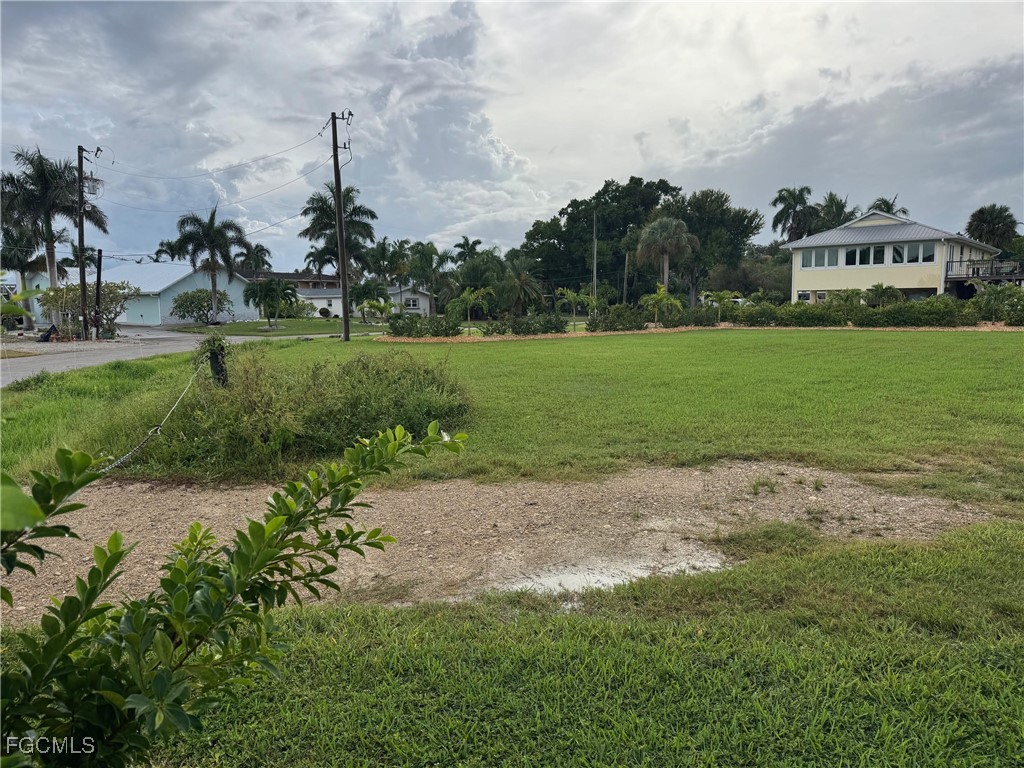 1746 Seafan Circle North Fort Myers, FL 33903 - Photo 4 of 5 a view of a park with large trees