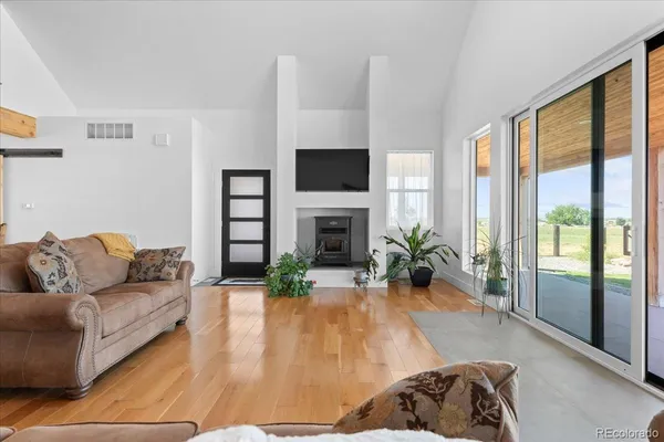 a living room with furniture fireplace and flat screen tv