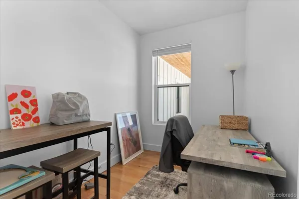 a bedroom with furniture and a window