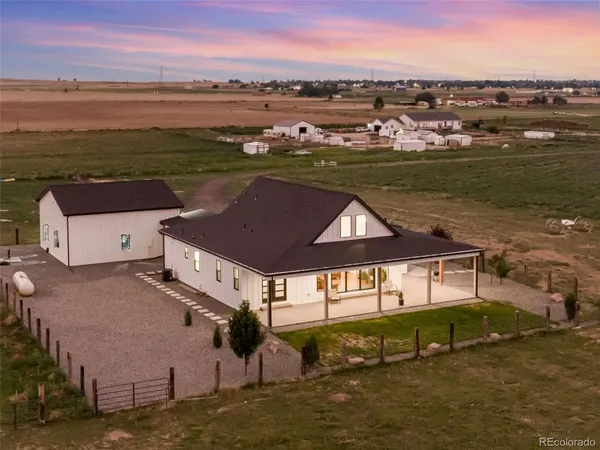 aerial view of a house with a lake view