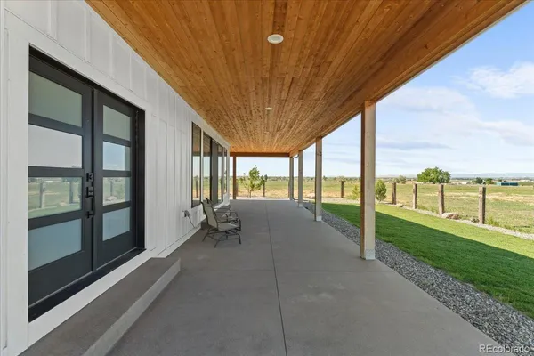 a view of a field with an ocean