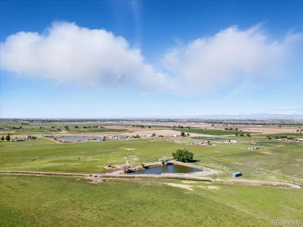 a view of swimming pool with outdoor seating