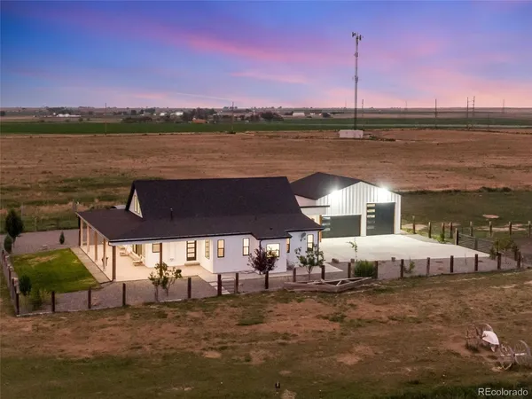 a view of a swimming pool with an outdoor seating