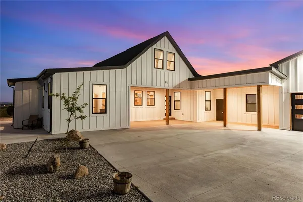 a view of swimming pool with an outdoor seating