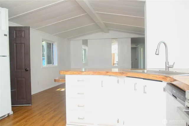a spacious bathroom with a granite countertop sink and a mirror