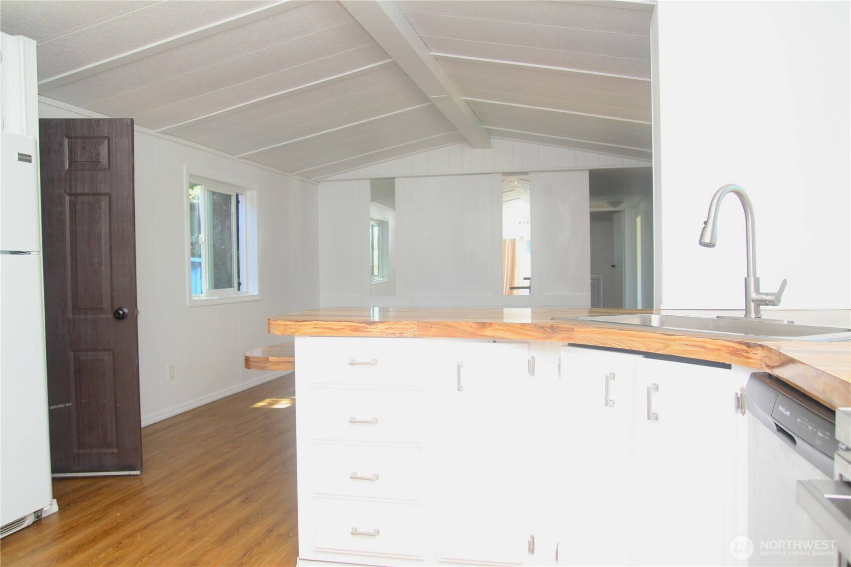 3060 Northeast McWilliams Road, Unit 9 Bremerton, WA 98311 - Photo 9 of 16 a spacious bathroom with a granite countertop sink and a mirror