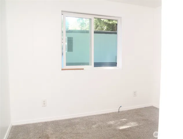 a view of a window in an empty room