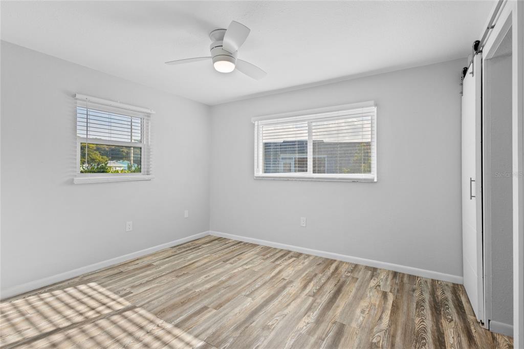 3801 42nd Street West Bradenton, FL 34205 - Photo 16 of 34 a view of empty room with wooden floor and fan