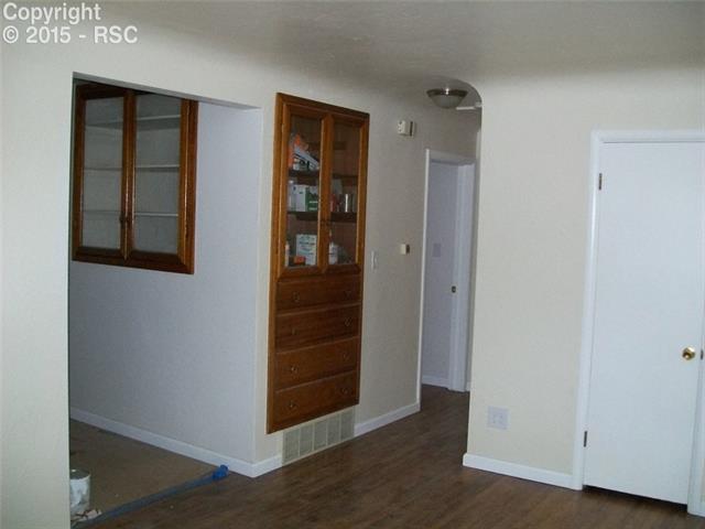 612 Sunset Road Colorado Springs, CO 80909 - Photo 10 of 27 Built In's Kitchen & Living Room