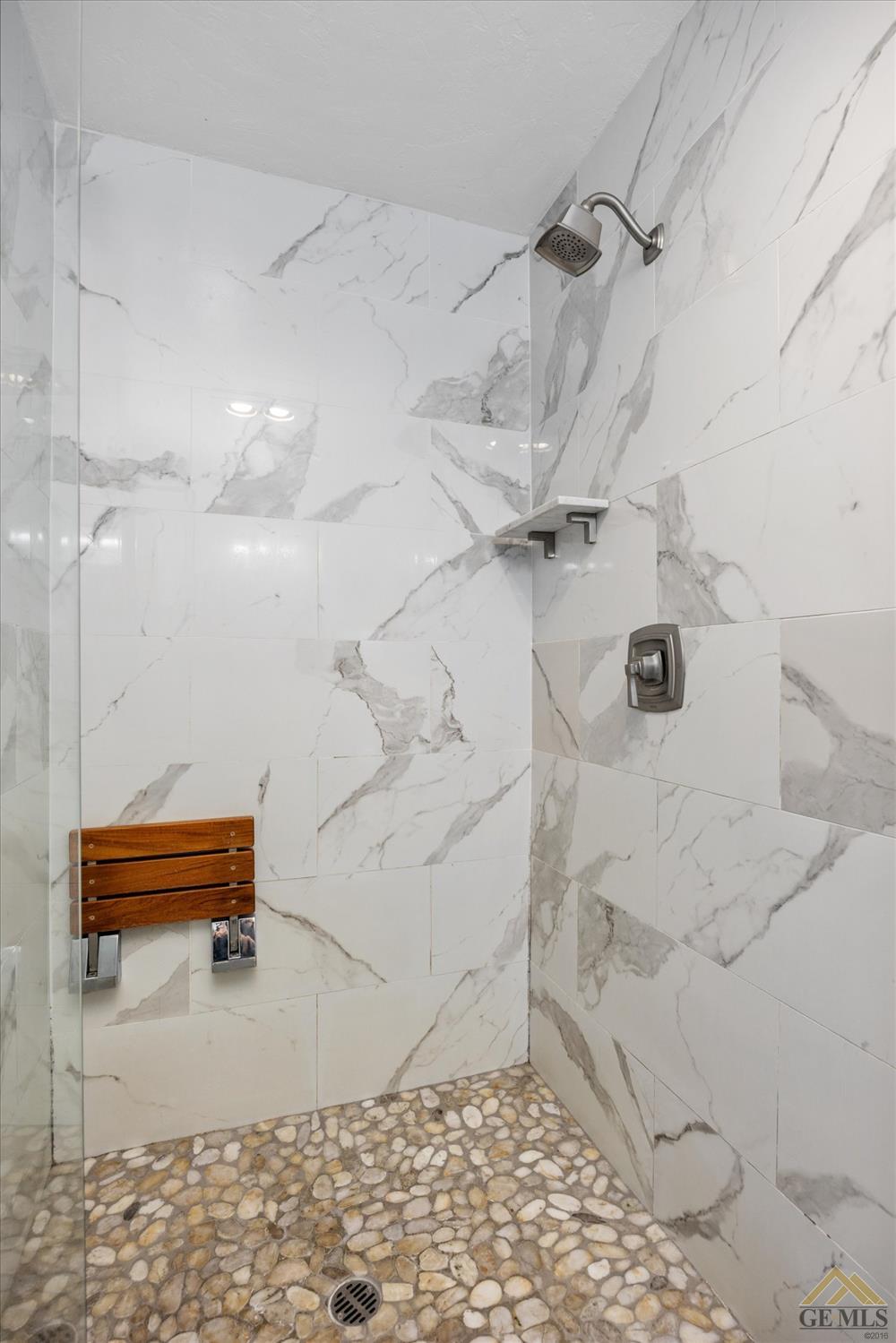 Undisclosed Address Bakersfield, CA 93308 - Photo 21 of 40 a bathroom with a shower and a shower