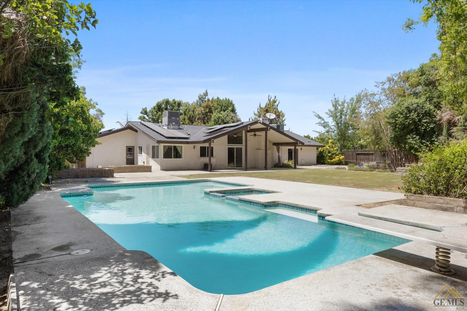 Undisclosed Address Bakersfield, CA 93308 - Photo 31 of 40 a house with swimming pool in front of it