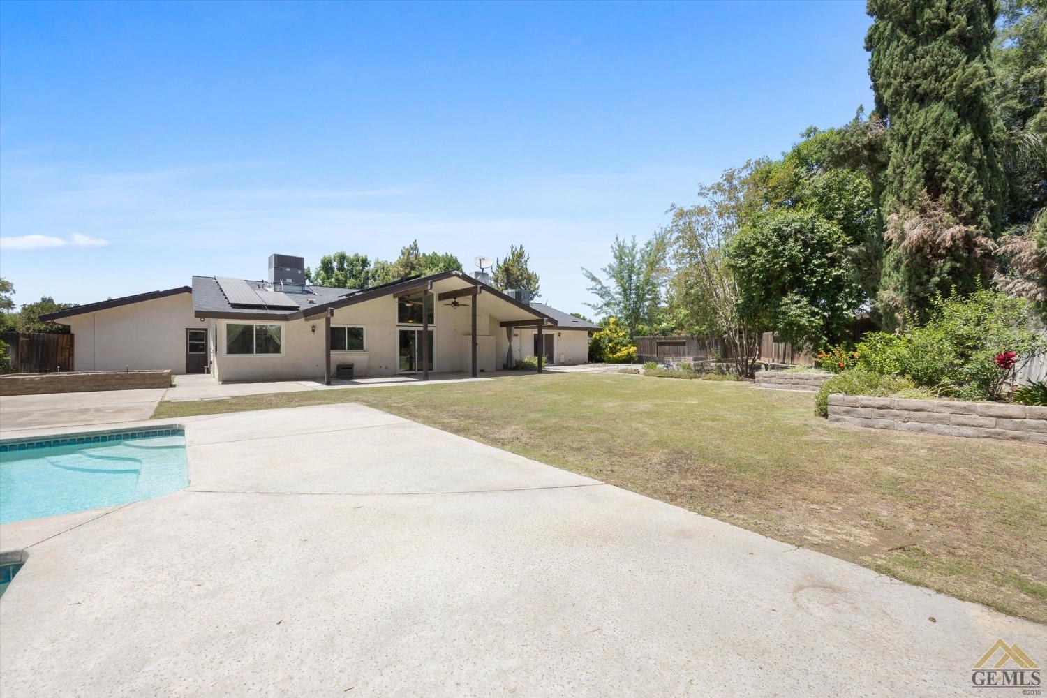 Undisclosed Address Bakersfield, CA 93308 - Photo 33 of 40 a front view of a house with a yard