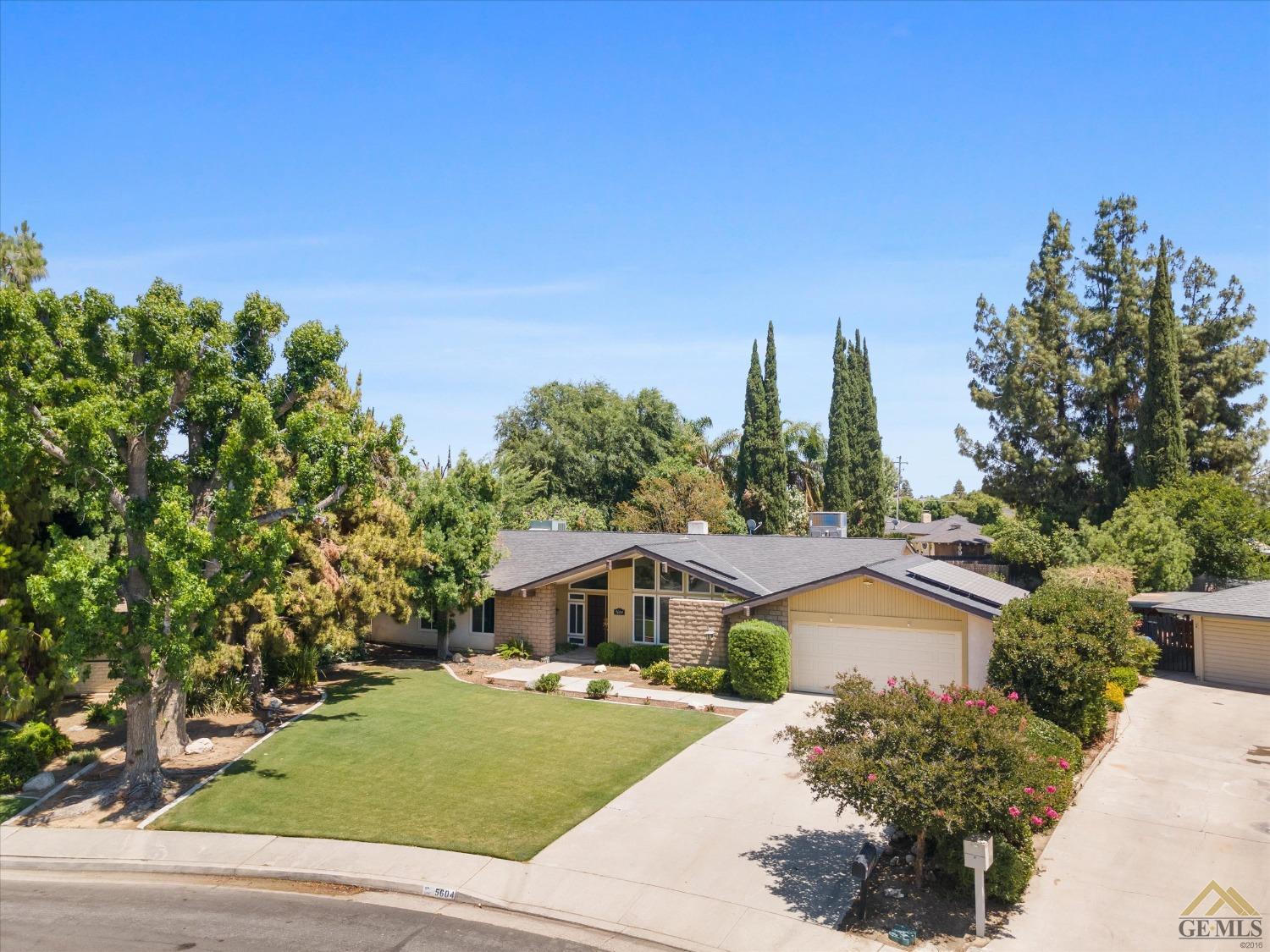 Undisclosed Address Bakersfield, CA 93308 - Photo 34 of 40 a view of a house with a yard and potted plants