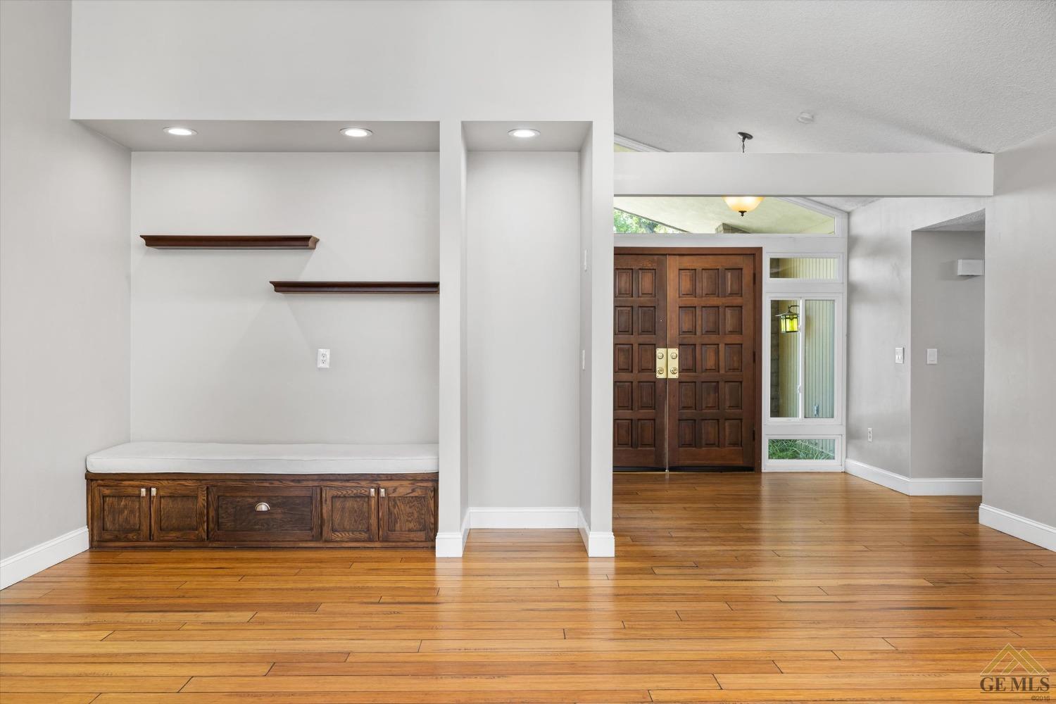 Undisclosed Address Bakersfield, CA 93308 - Photo 8 of 40 a view of a hallway with wooden floor