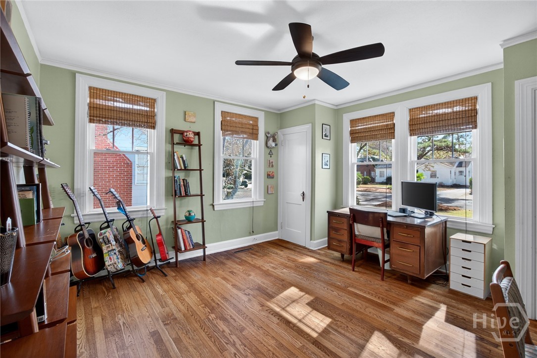 512 East 58th Street Savannah, GA 31405 - Photo 15 of 44 First bedroom on first floor with view of front yard
