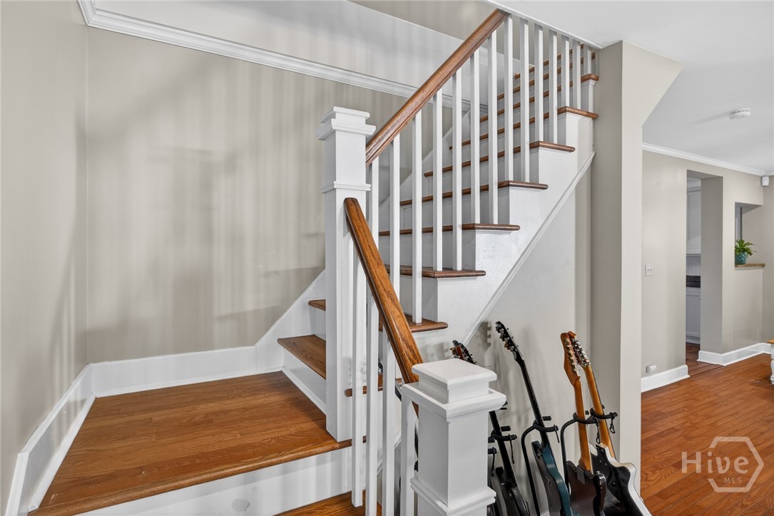 512 East 58th Street Savannah, GA 31405 - Photo 21 of 44 Stairs in family room leading to two bedrooms and bathroom upstairs