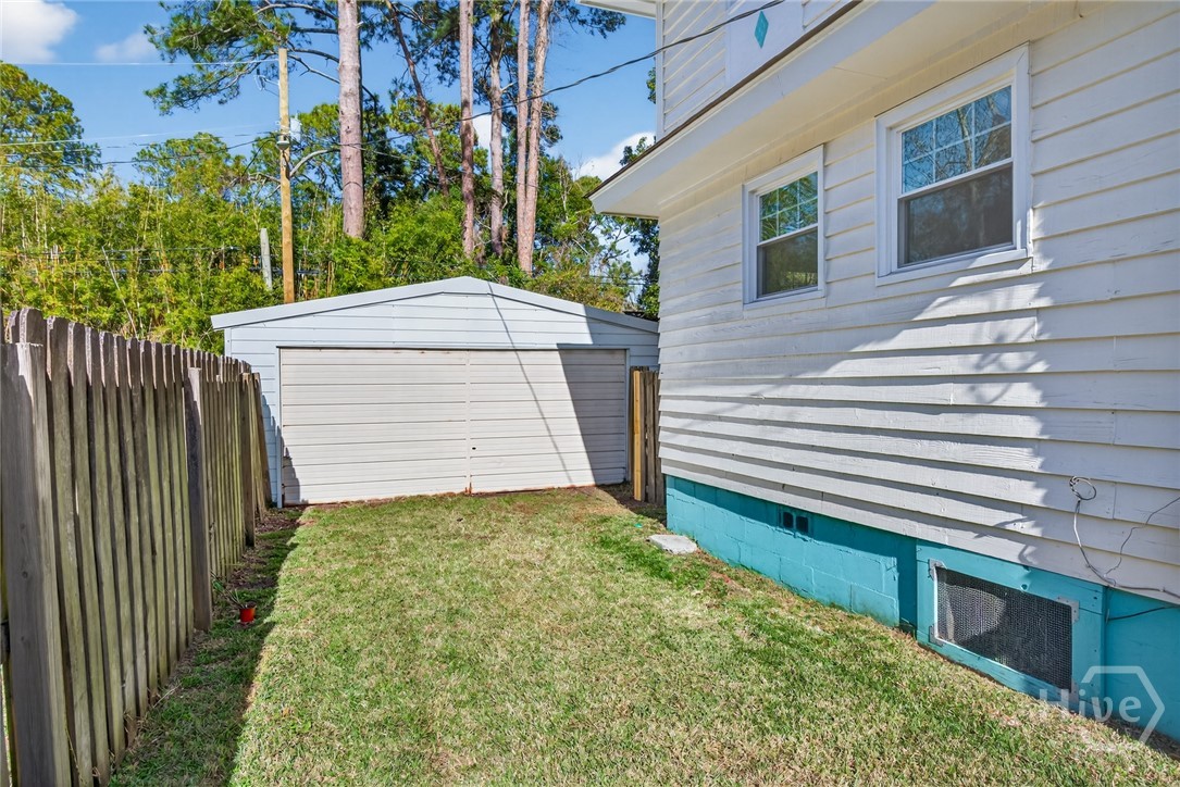 512 East 58th Street Savannah, GA 31405 - Photo 34 of 44 View of garage entrance from side yard. Could be a space to store a boat