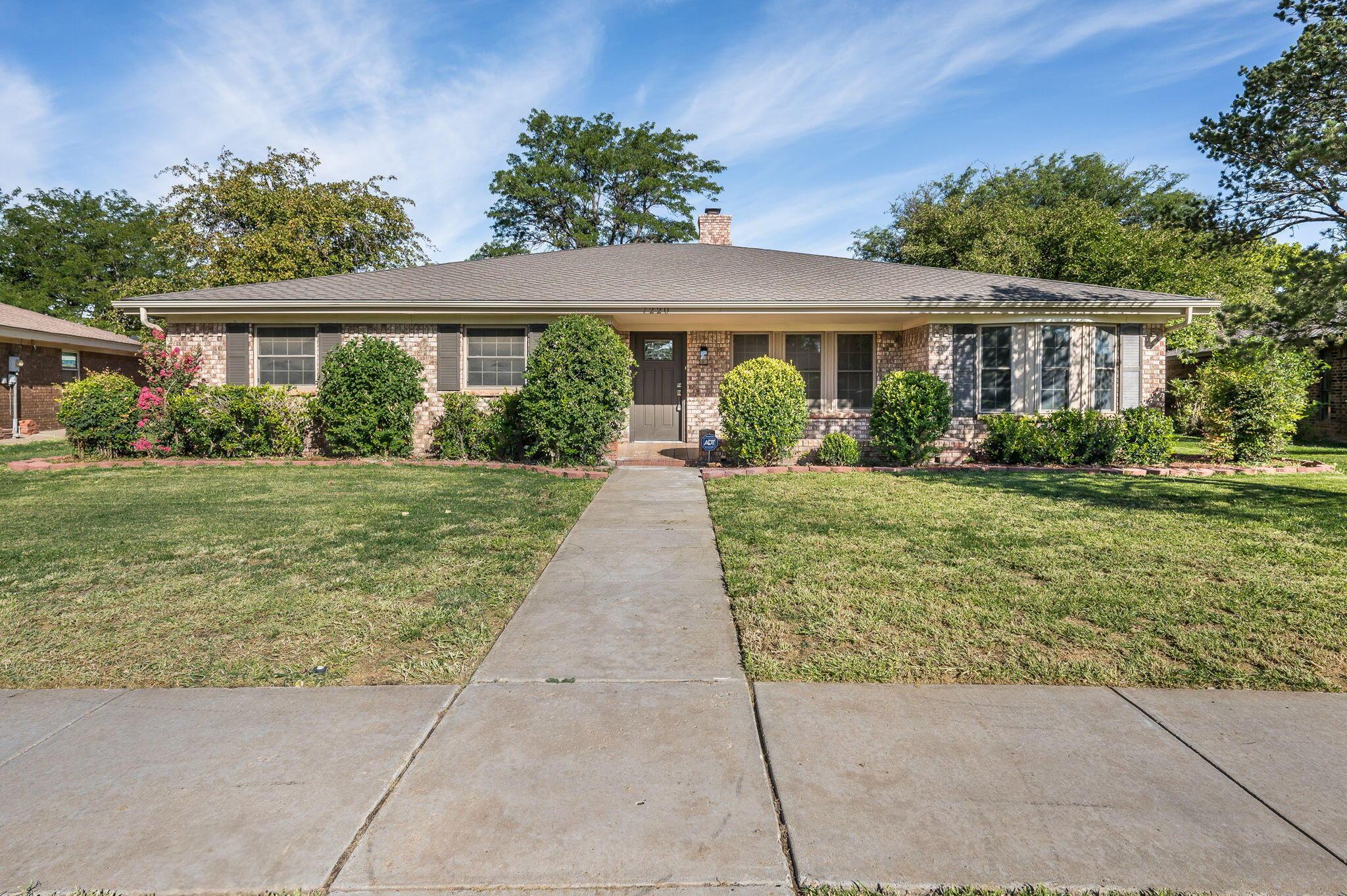 7220 Montague Drive Amarillo, TX 79109 - Photo 1 of 29 a front view of a house with a yard