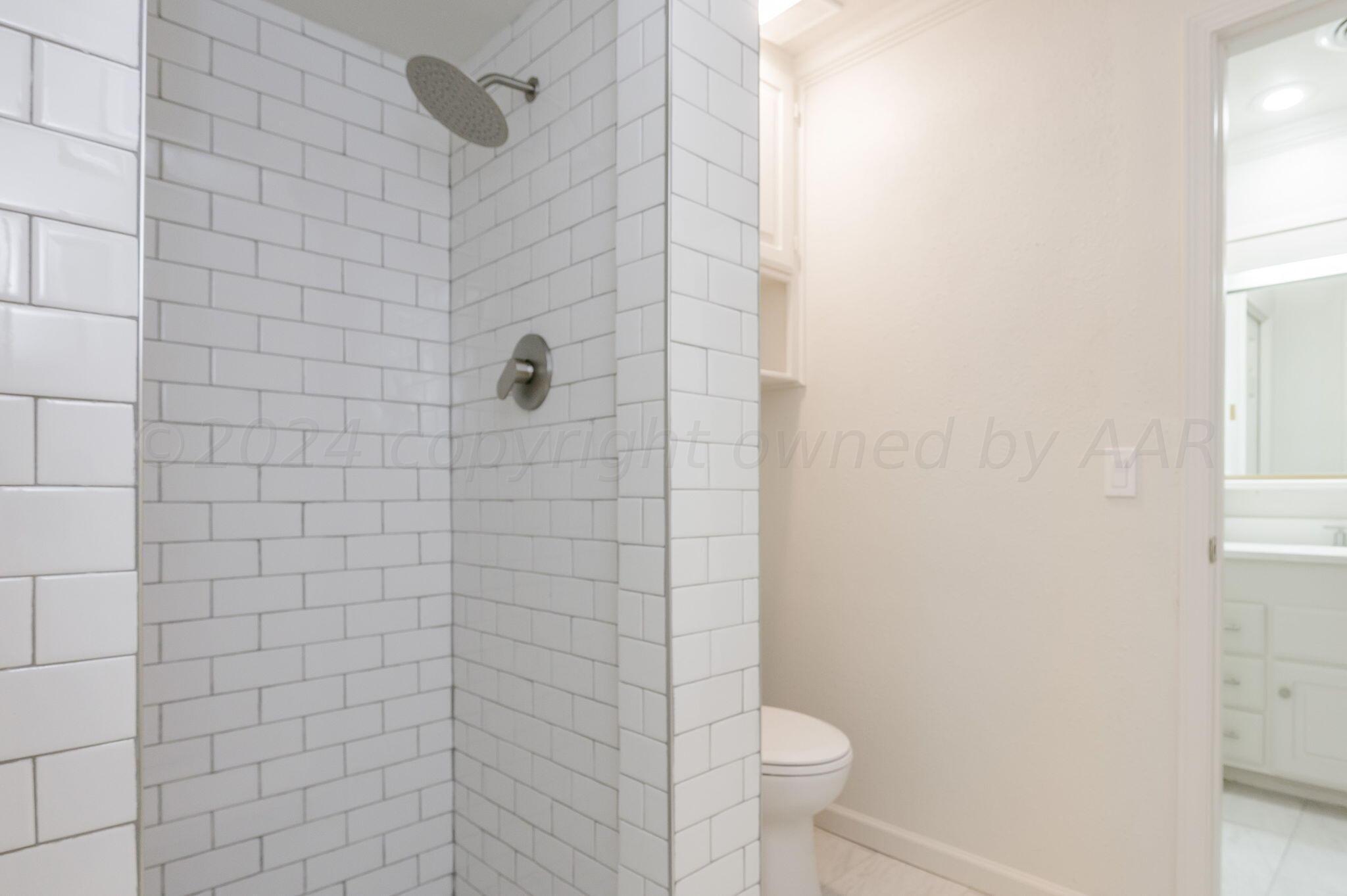 7220 Montague Drive Amarillo, TX 79109 - Photo 18 of 29 a bathroom with a shower