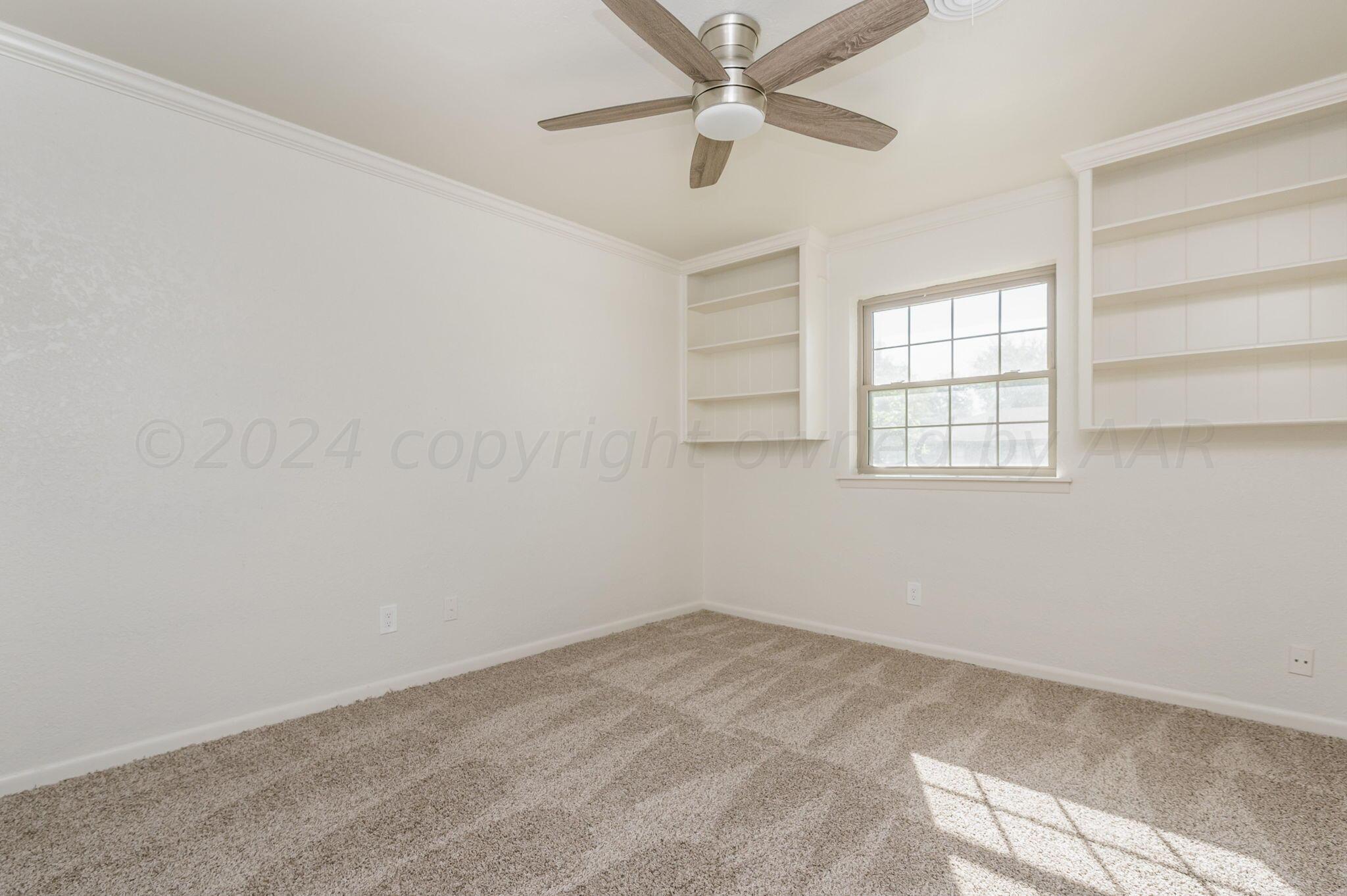 7220 Montague Drive Amarillo, TX 79109 - Photo 23 of 29 an empty room with windows and fan view