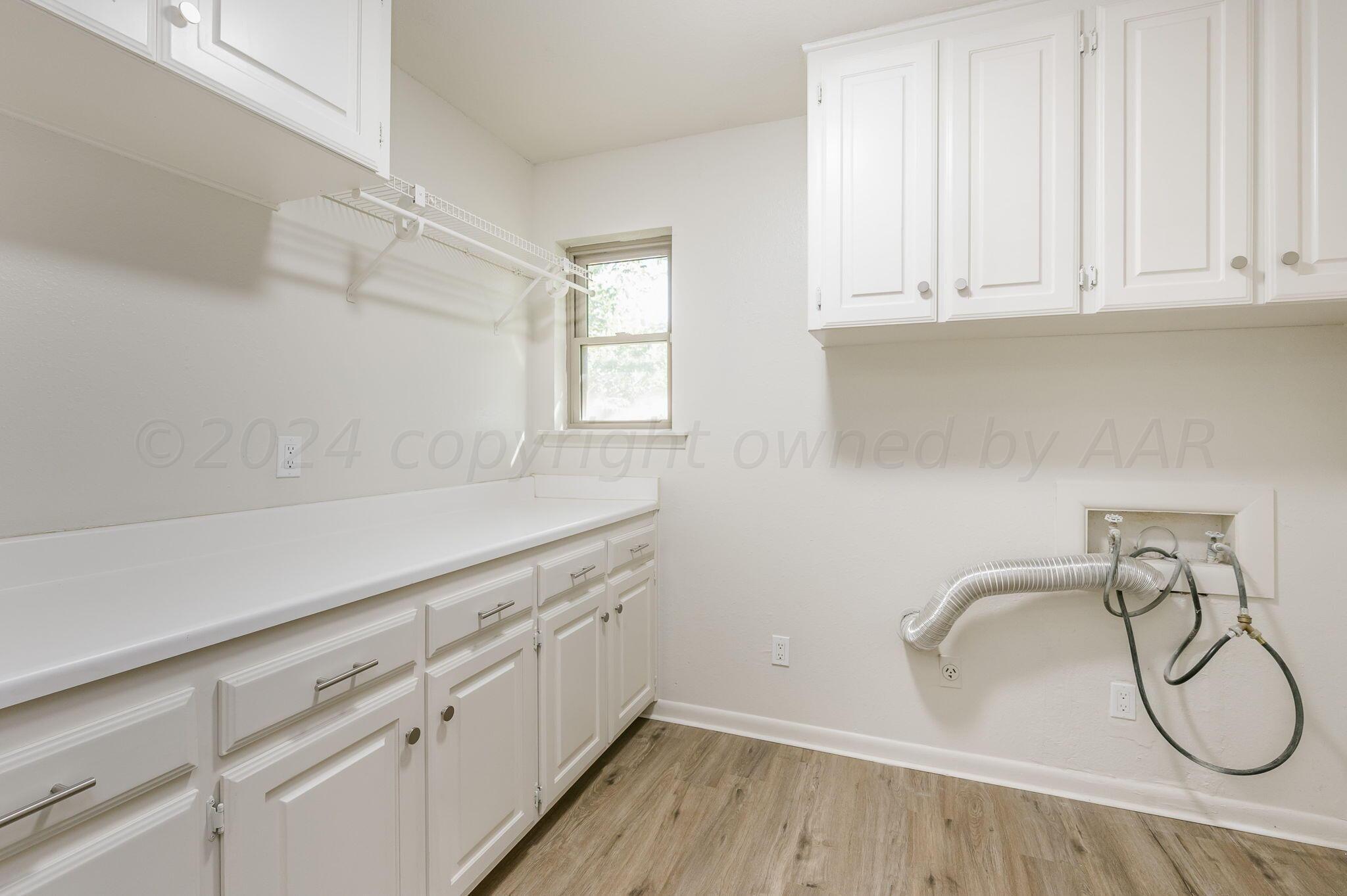7220 Montague Drive Amarillo, TX 79109 - Photo 24 of 29 a bathroom with a sink and a window