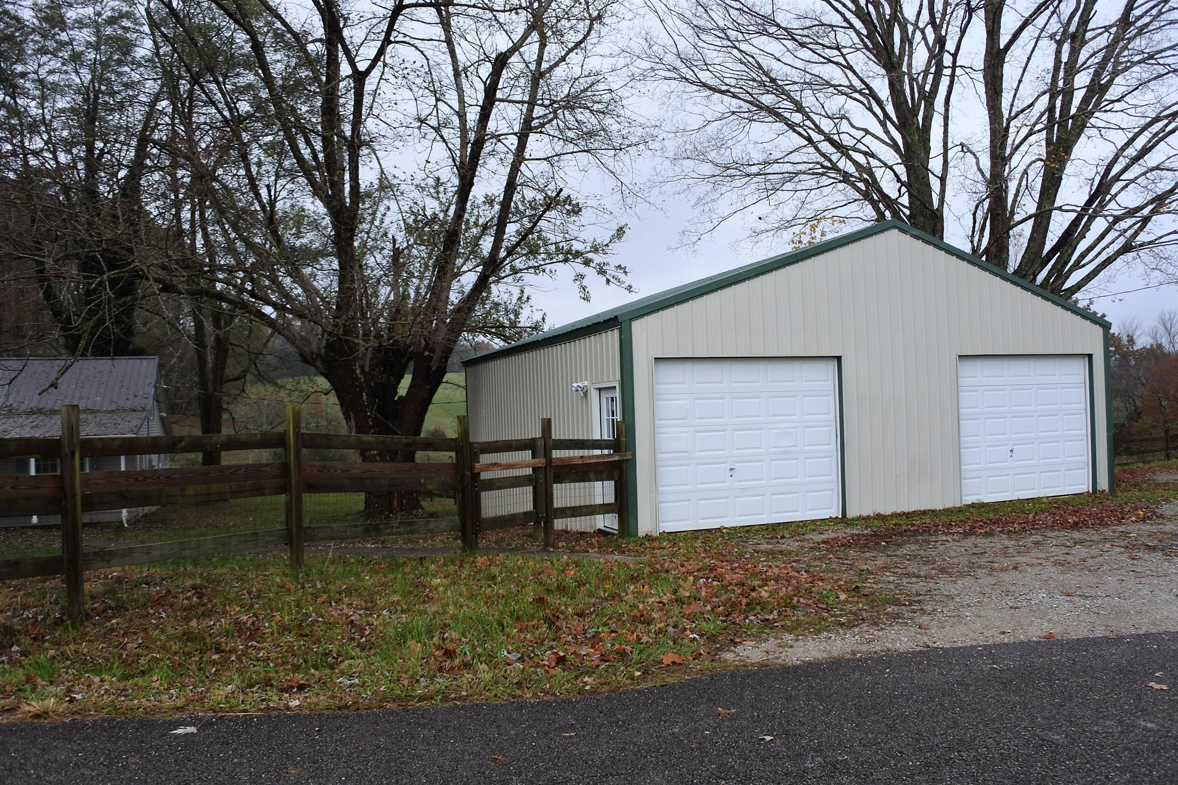 375 Lonesome Valley Road Allons, TN 38541 - Photo 11 of 23 a view of a house with a yard and large tree