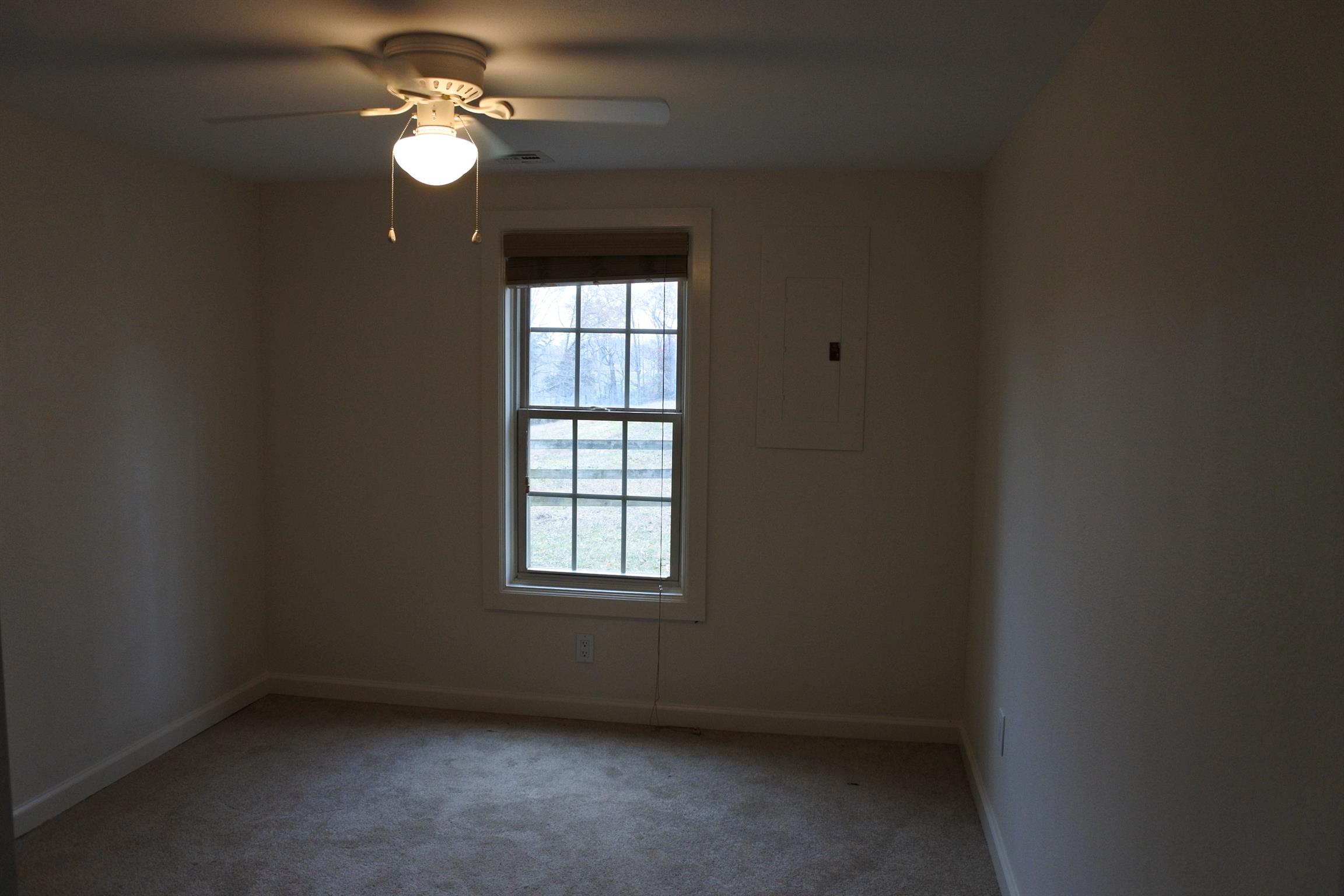 375 Lonesome Valley Road Allons, TN 38541 - Photo 14 of 23 an empty room with windows and fan