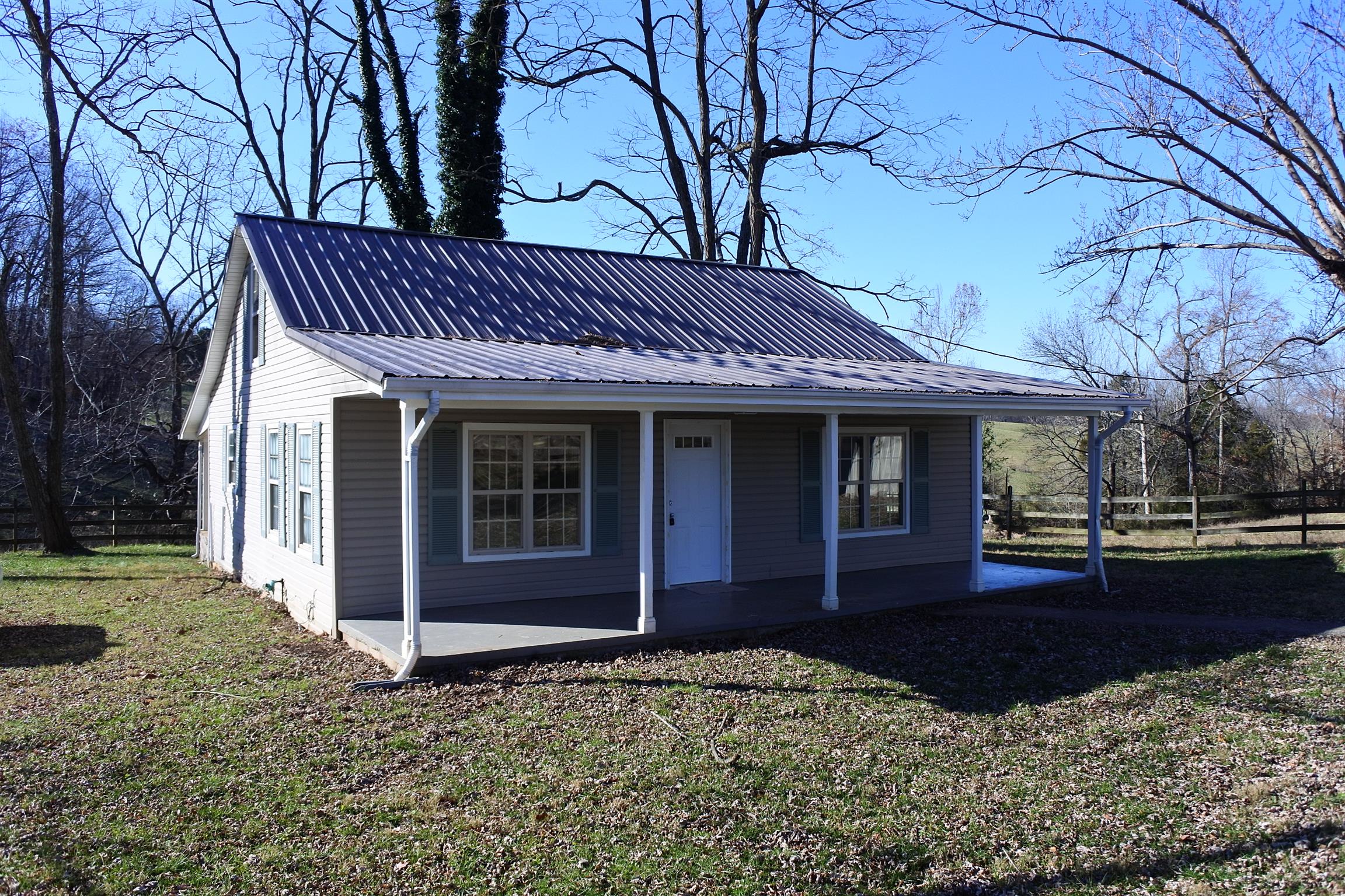 375 Lonesome Valley Road Allons, TN 38541 - Photo 2 of 23 a front view of a house with garden