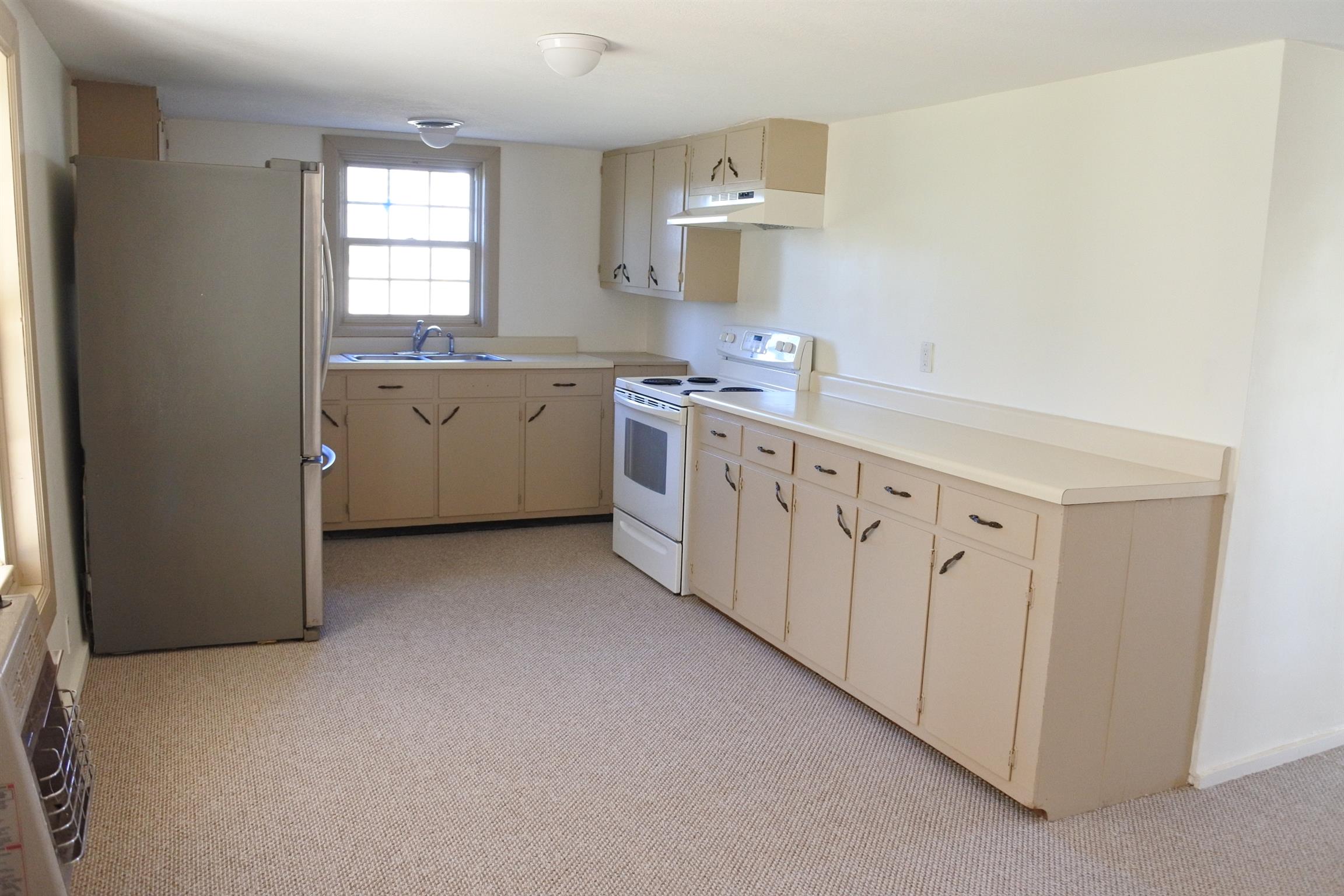 375 Lonesome Valley Road Allons, TN 38541 - Photo 4 of 23 a kitchen with cabinets a sink and a window