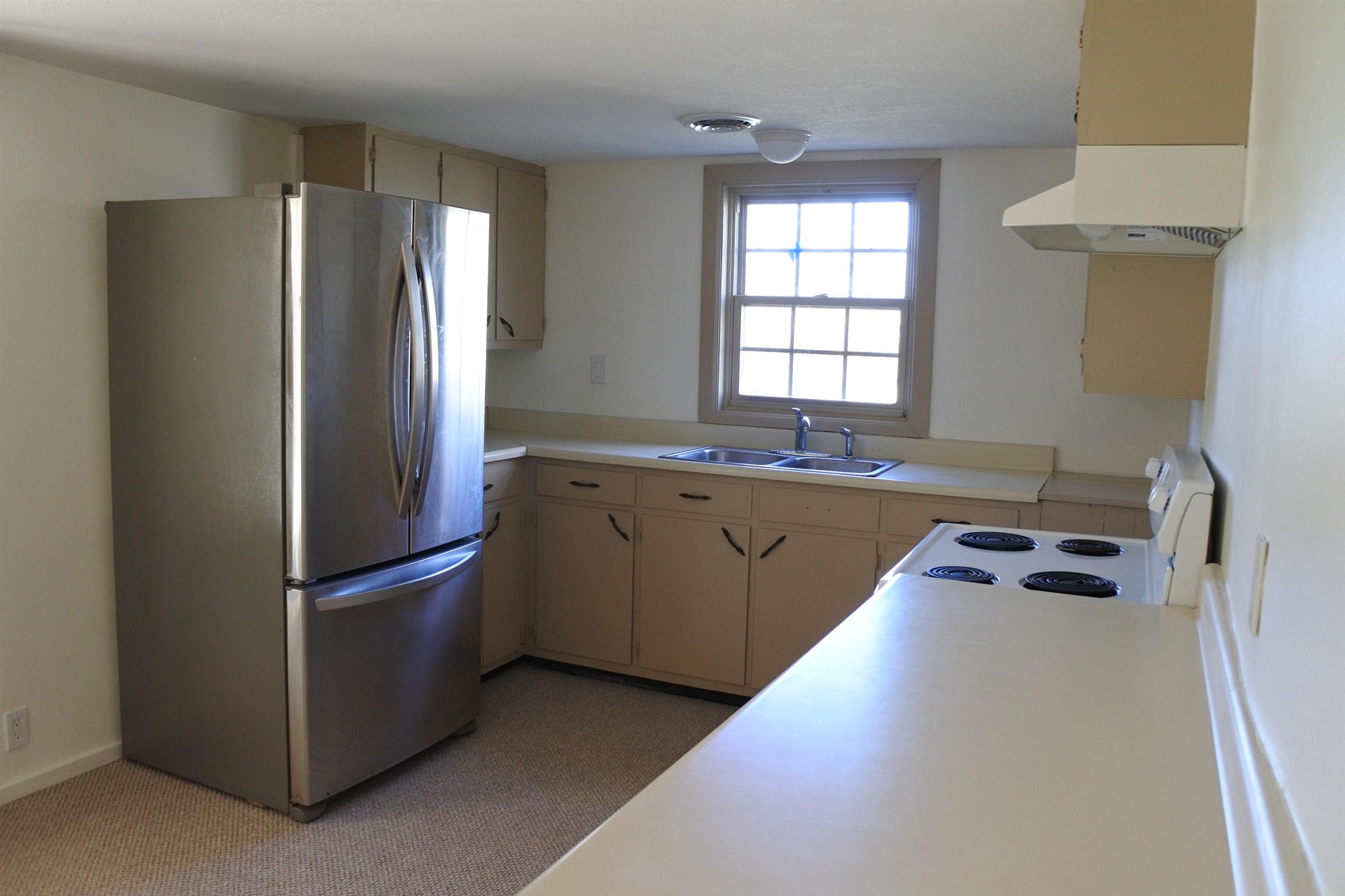 375 Lonesome Valley Road Allons, TN 38541 - Photo 5 of 23 a kitchen with stainless steel appliances granite countertop a refrigerator a sink and a stove