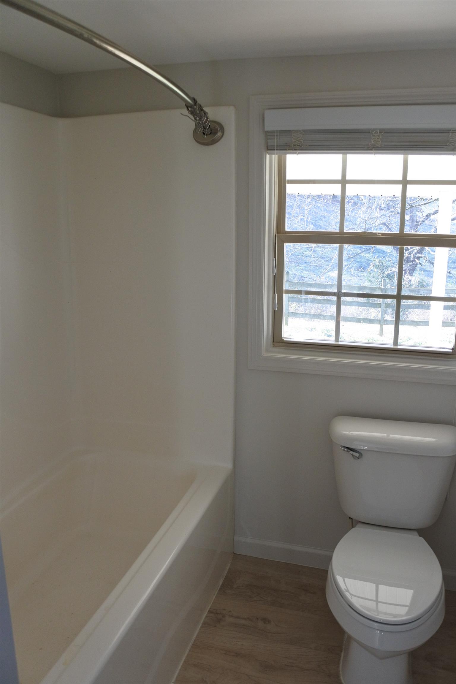 375 Lonesome Valley Road Allons, TN 38541 - Photo 7 of 23 a white toilet sitting next to a window