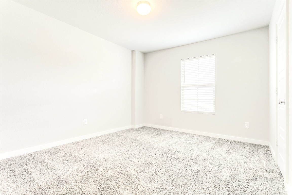 9111 Spigel Way Converse, TX 78109 - Photo 10 of 13 a view of an empty room with a window