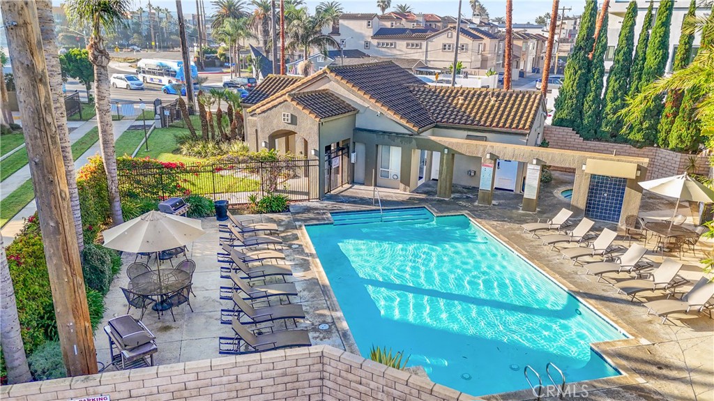 430 Lake Street, Unit 304 Huntington Beach, CA 92648 - Photo 44 of 46 a front view of a house with a garden