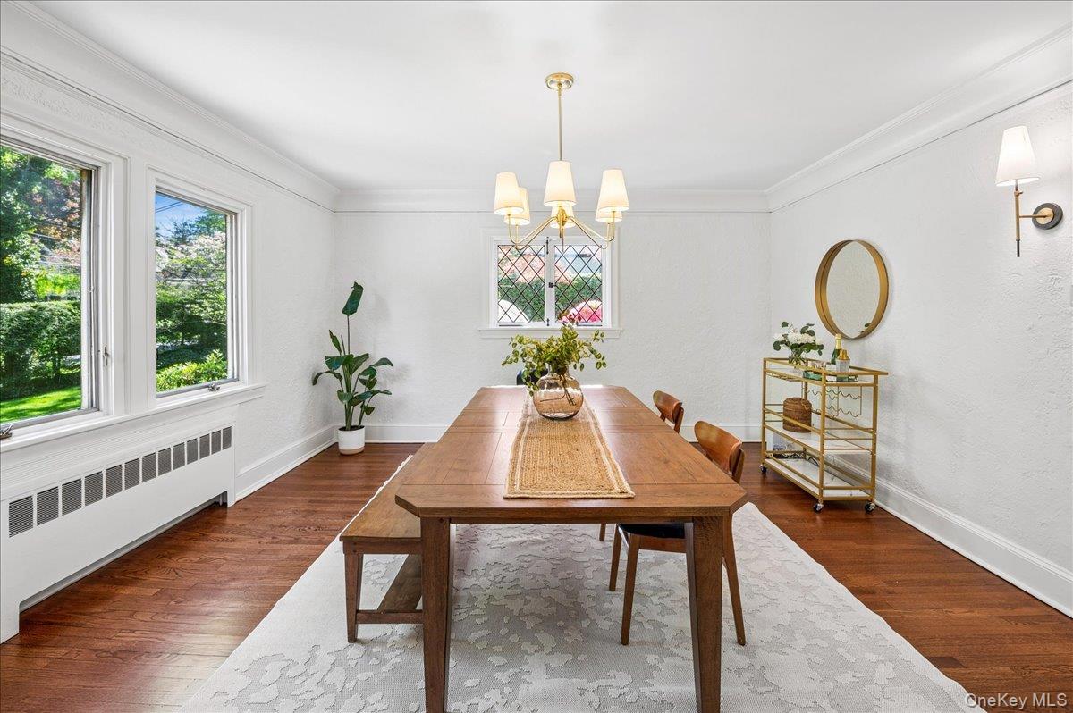 62 Broadfield Road New Rochelle, NY 10804 - Photo 10 of 41 Spacious dining room with hardwood flooring, crown molding, and large windows