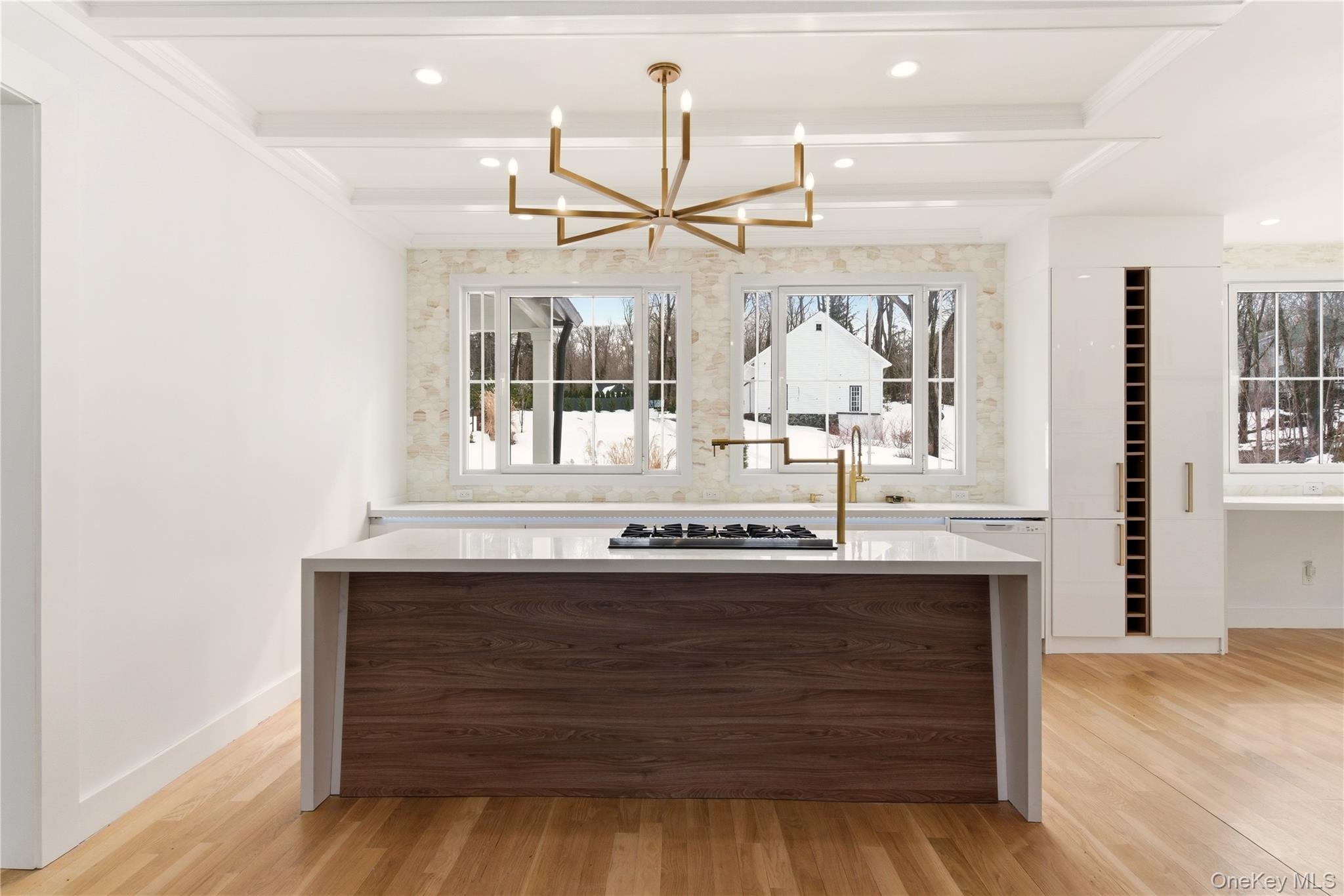 77 Cove Road Oyster Bay, NY 11771 - Photo 12 of 45 a view of a kitchen counter space a sink and wooden floor