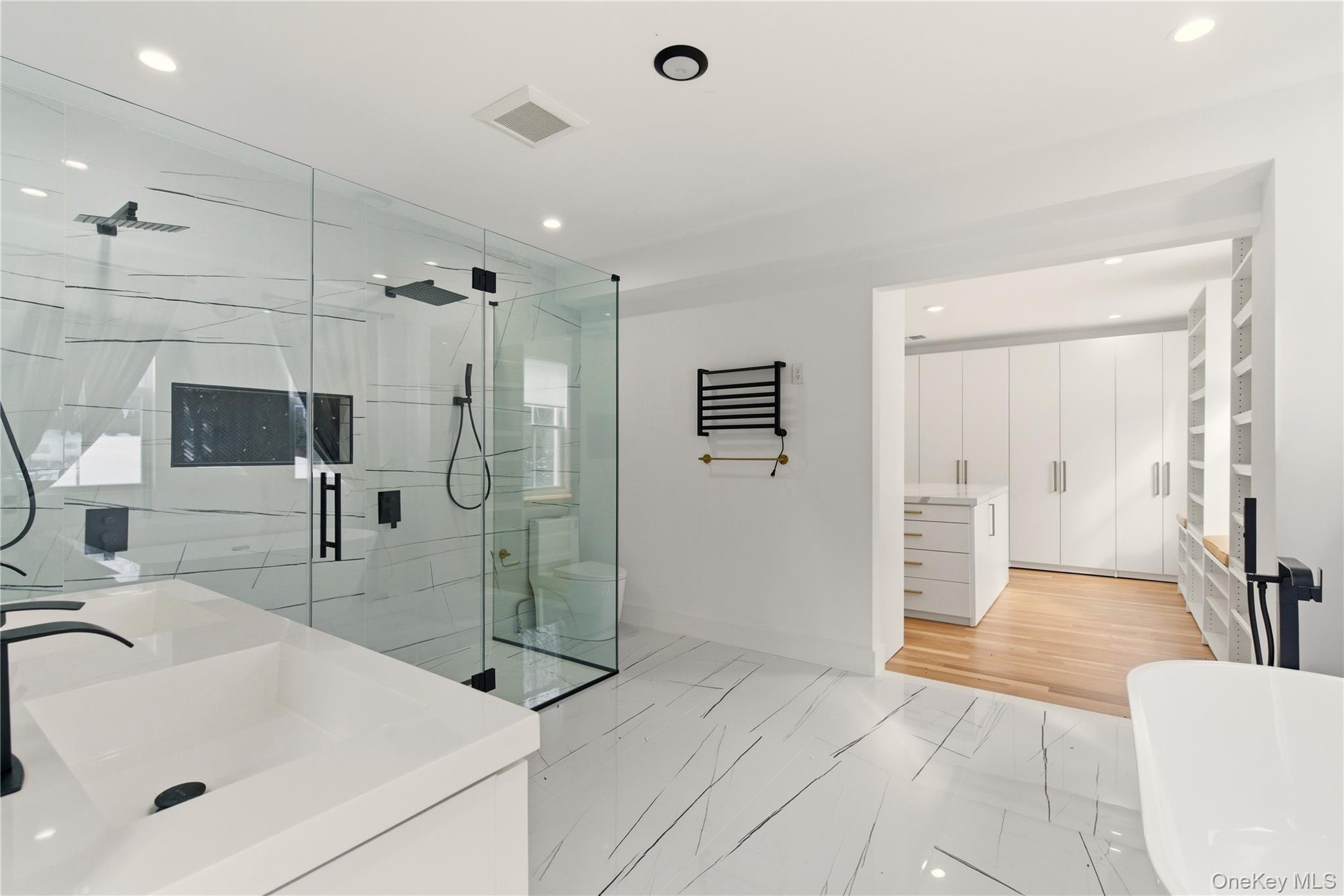 77 Cove Road Oyster Bay, NY 11771 - Photo 20 of 45 a bathroom with a sink and a mirror