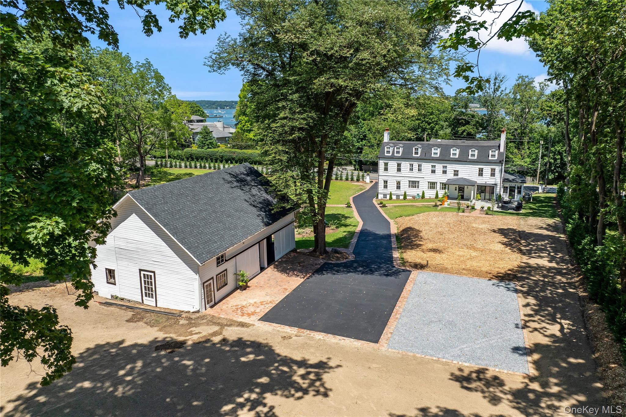77 Cove Road Oyster Bay, NY 11771 - Photo 37 of 45 a view of a house with backyard and sitting area
