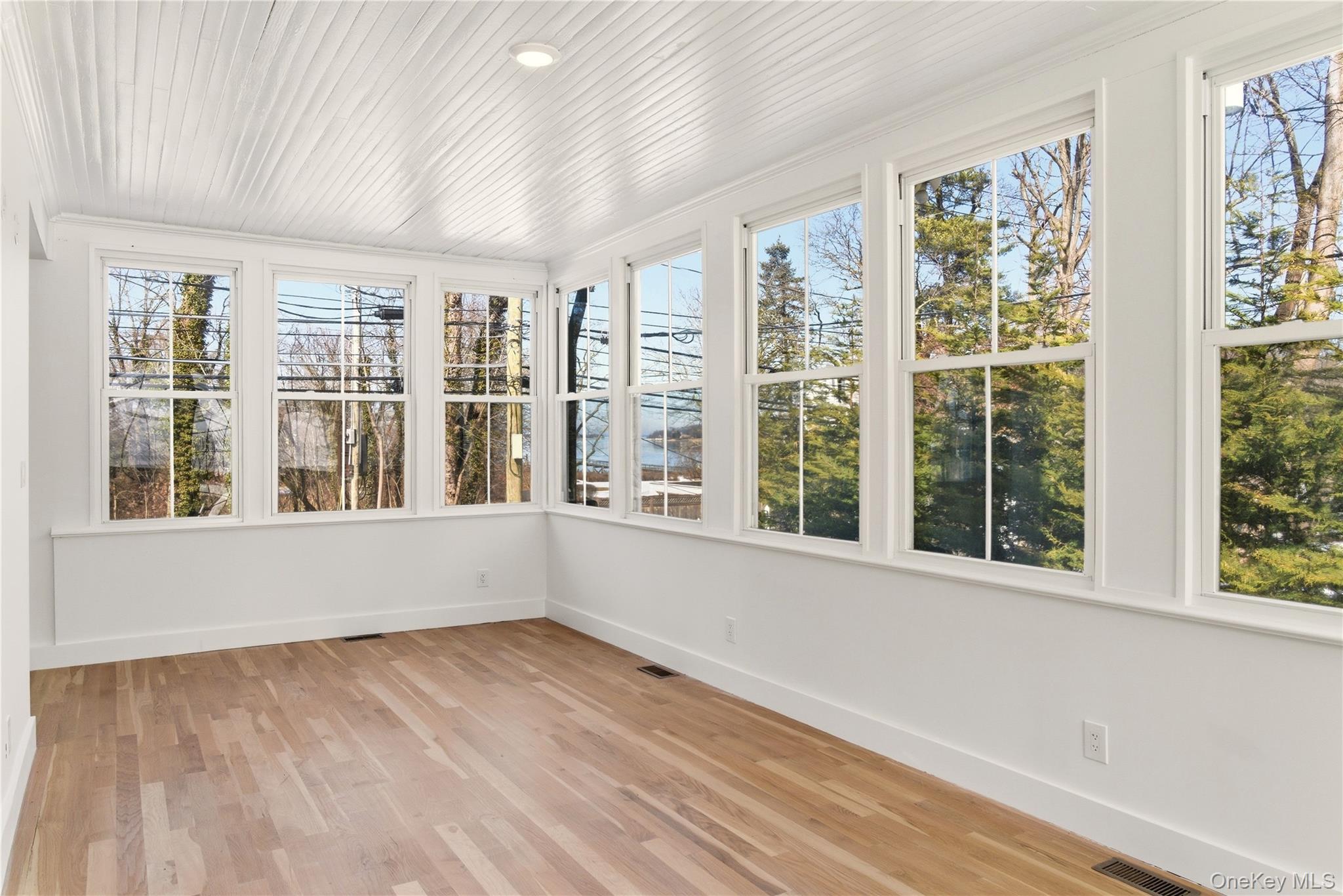 77 Cove Road Oyster Bay, NY 11771 - Photo 10 of 45 a view of an empty room with a window