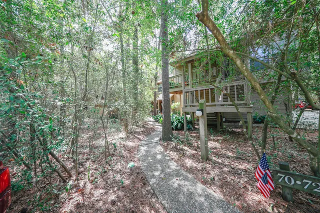 a view of balcony with wooden floor