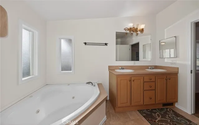 a bath room with a sink and a mirror
