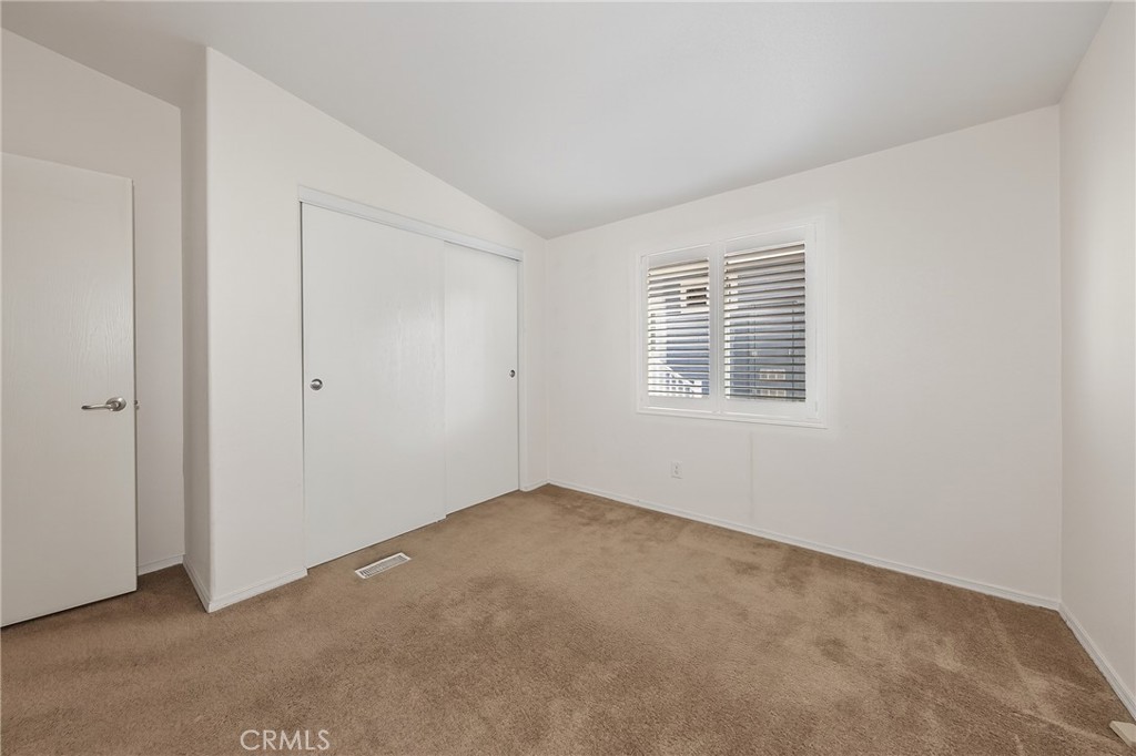 12367 4th Street, Unit 71 Yucaipa, CA 92399 - Photo 17 of 25 a view of an empty room with a window