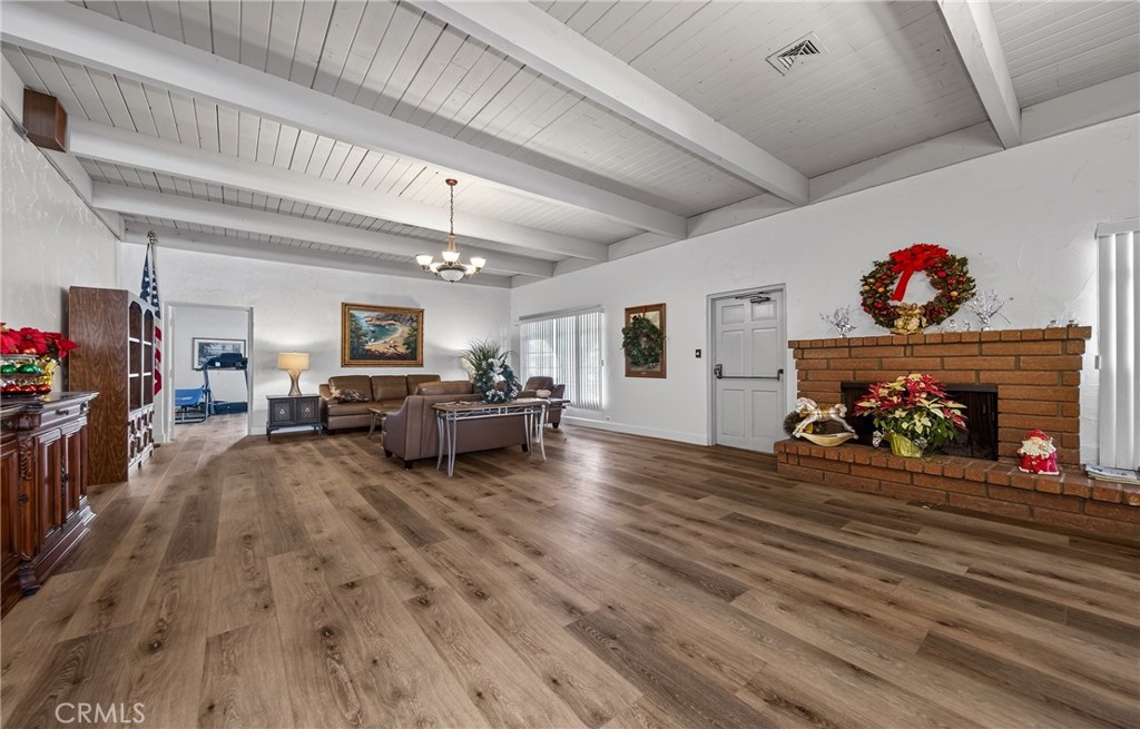 12367 4th Street, Unit 71 Yucaipa, CA 92399 - Photo 22 of 25 a living room with furniture and a fireplace